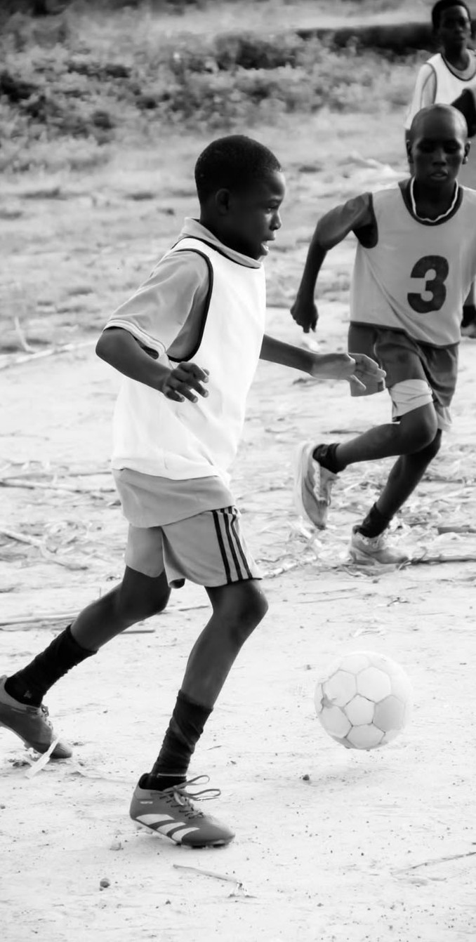 Young players in a soccer match in Dimbaza